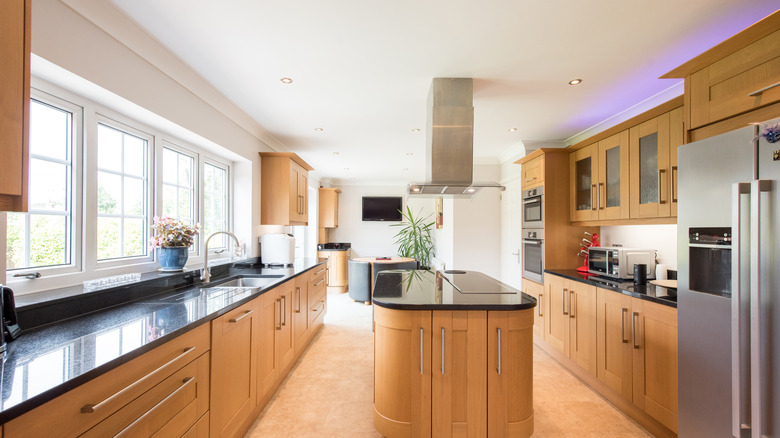 Kitchen with oak cabinets and light neutral walls to complement the wood tones