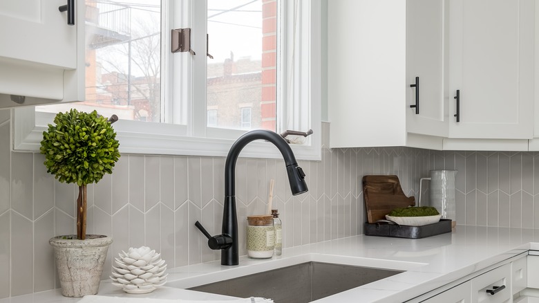 kitchen cabinets and tile backsplash