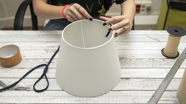 Person revamping an old lampshade