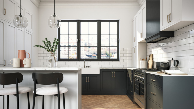 A blue and white kitchen with a subway tile backsplash that end several feet about the counter