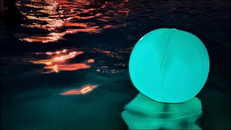 LED blue beach ball in the water