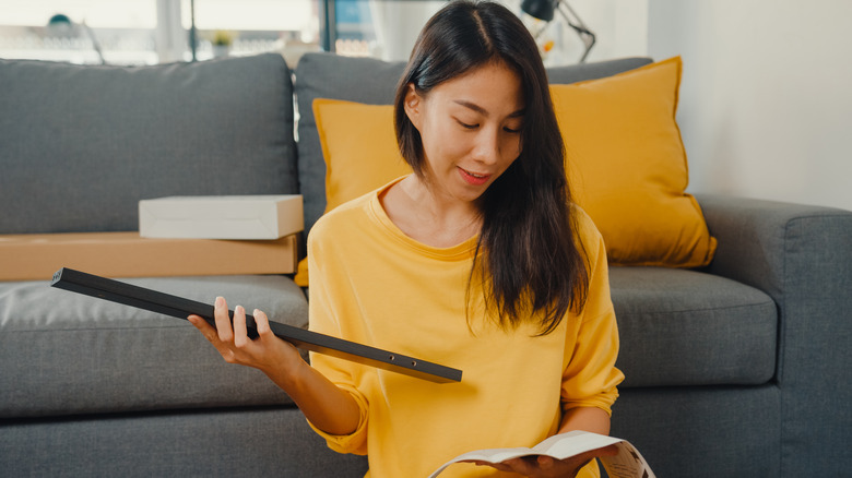 Woman assembling Ikea furniture