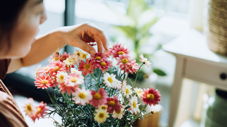 Person arranging flowers