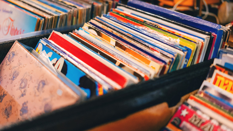 Several boxes full of vinyl records.