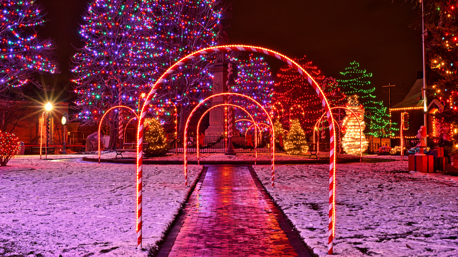 Use A Few Dollar Tree Brooms To DIY A Stunning Holiday Light Archway