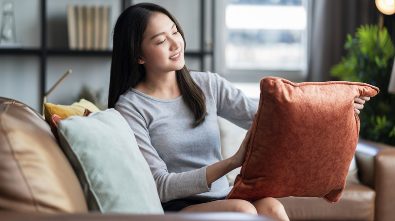 Person holding cushion