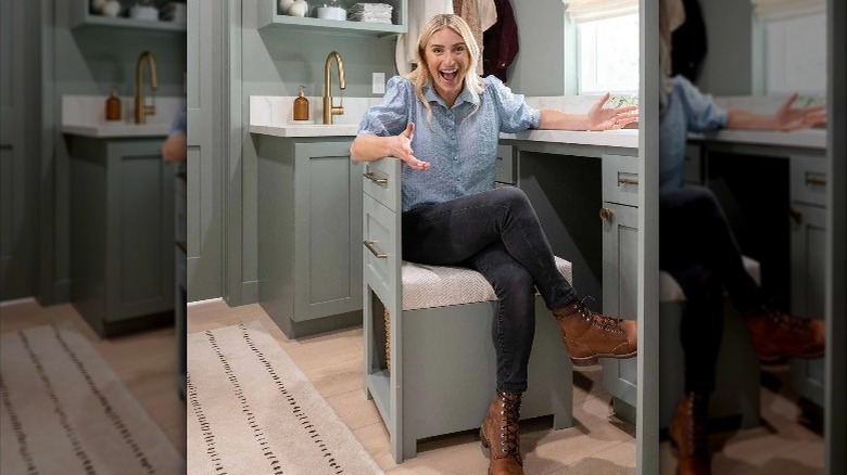 Jasmine Roth showing off her hidden desk in the laundry room