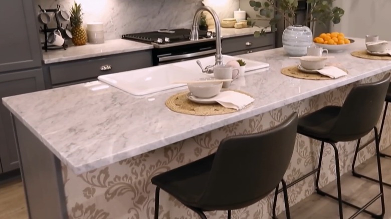 A kitchen island with wallpaper