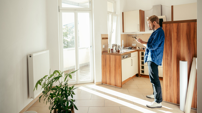 Person in half-empty kitchen