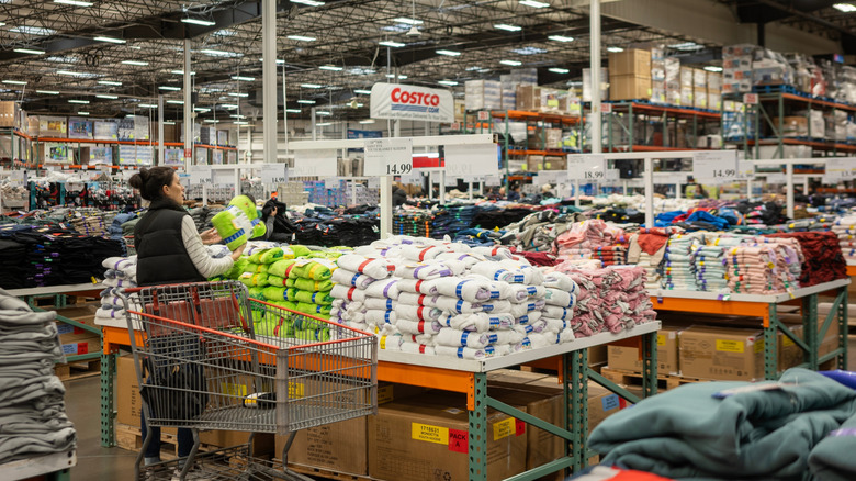 Shopper buying blankets at Costco