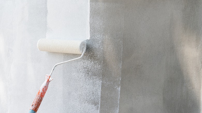 painting a concrete wall