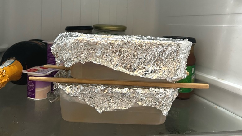 Chopsticks resting on bowl