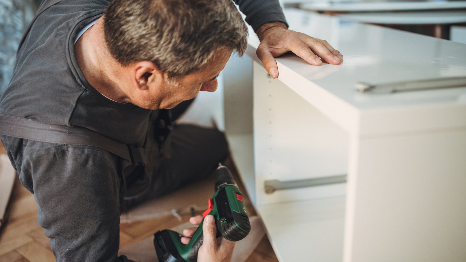 Drill holes before or after painting cabinets