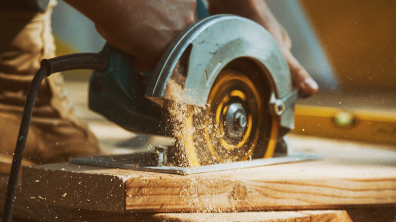 circular saw cutting wood