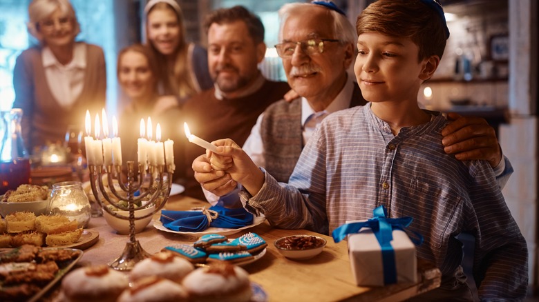 Family lights menorah candle 