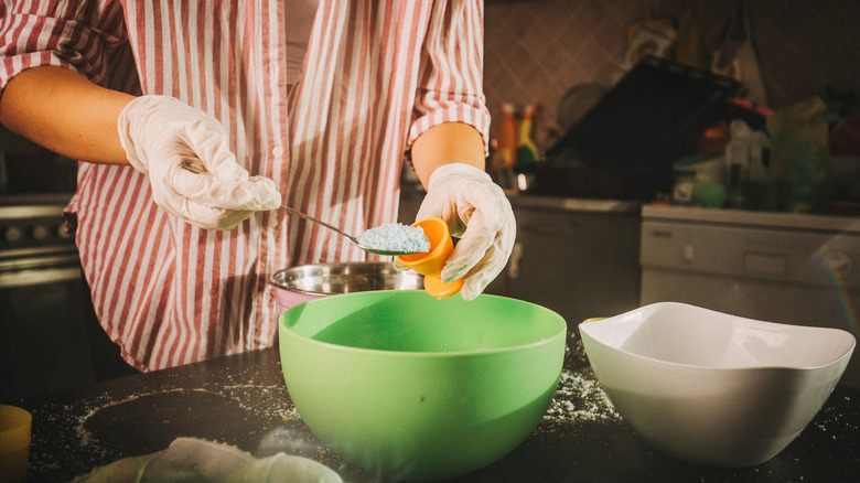 woman mixing up a toilet bomb