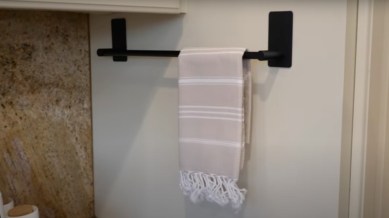 towel holder on outside of cabinets