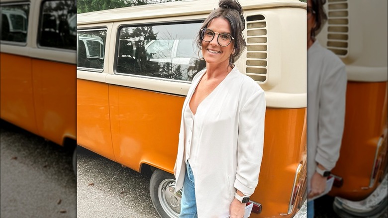 Lyndsay Lamb with orange car