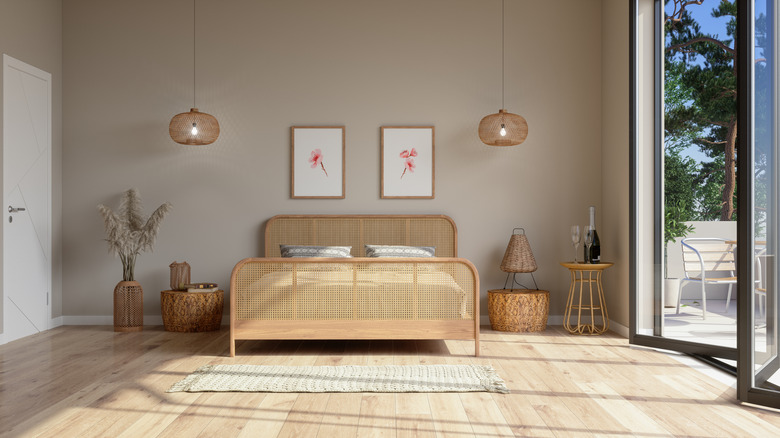 Bedroom with oak floors and beige walls