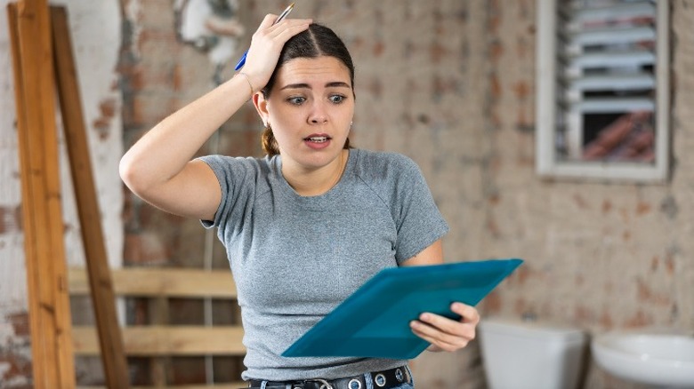 Woman's hand on her head