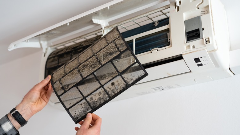 Changing dusty air conditioning filter