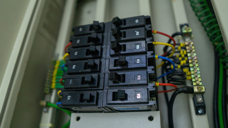 A small, organized load center with two tripped circuit breakers