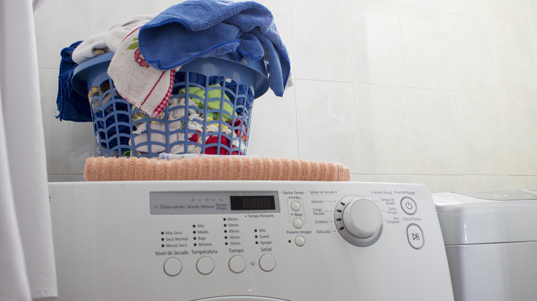 Laundry placed on top of a washing machine