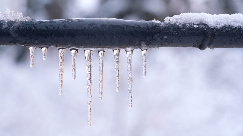 Icicles and snow on pipe