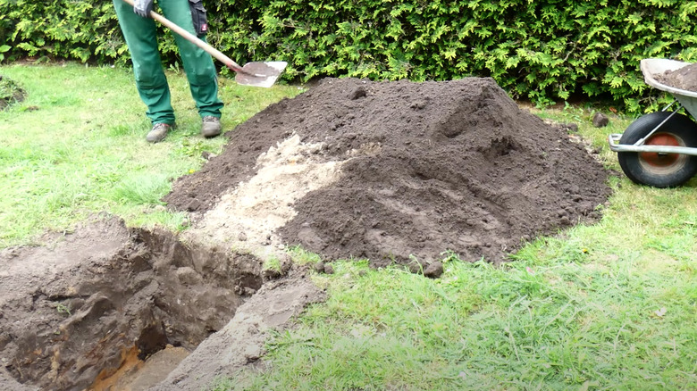 Person digging rill hole