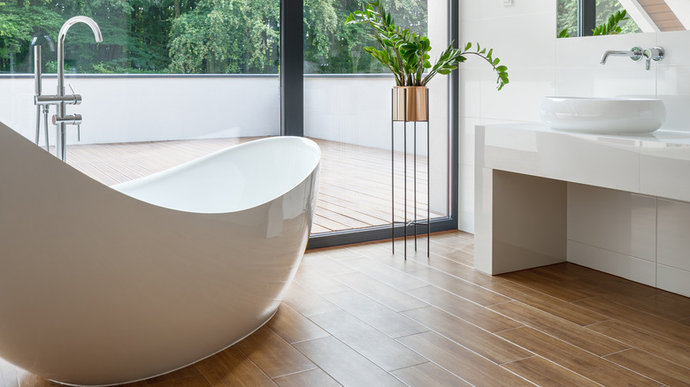 bathroom with wood tile flooring