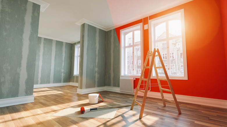 Home renovation in progress with painted orange walls