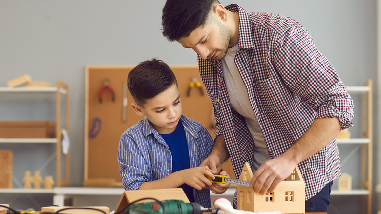 man and child working together