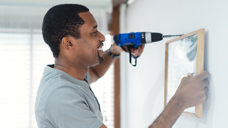 man smiling during DIY project