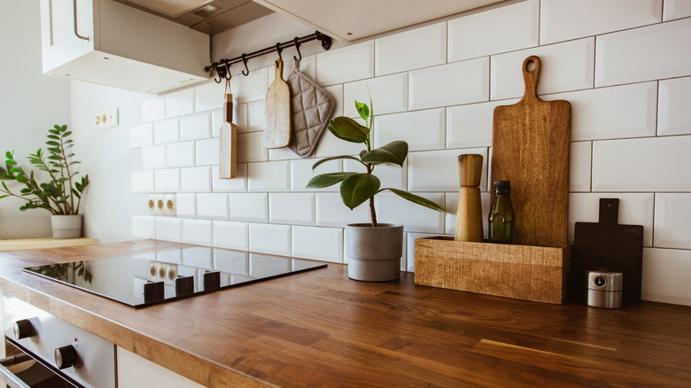 wood cutting board leaning on counter