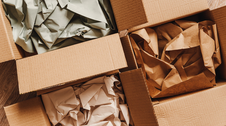 cardboard boxes with crumpled paper inside