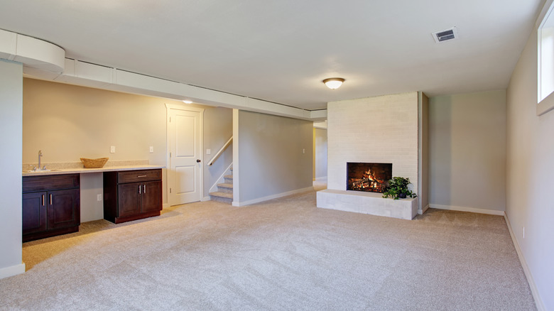 An electric fireplace with a white mantel