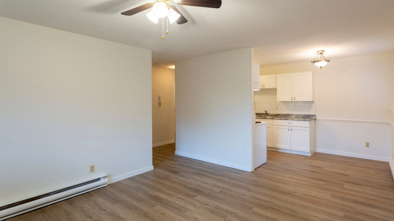 A baseboard heater in an open room