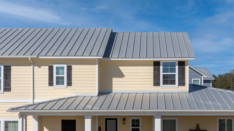 two-story home with standard gray metal roof