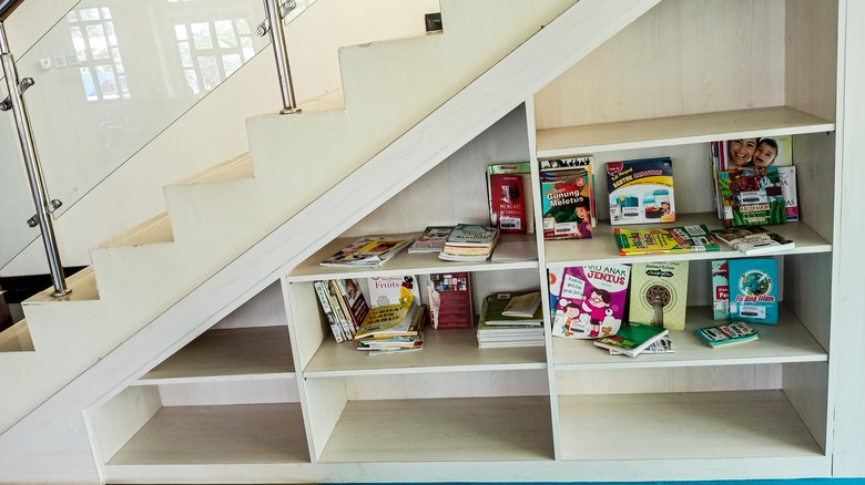 Books under a stairwell 