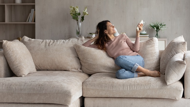 woman relaxing on couch