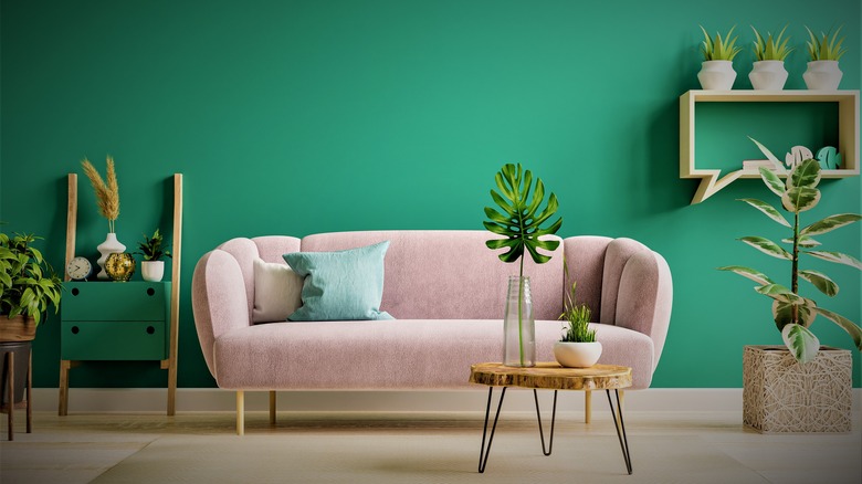 Pink couch in green room