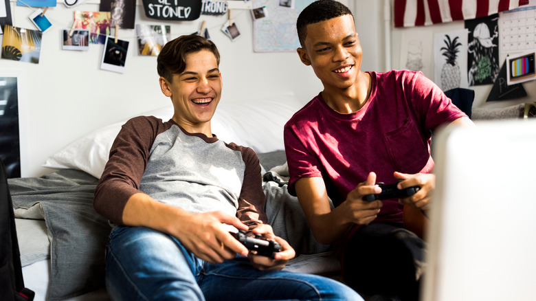 Teen boys playing video games