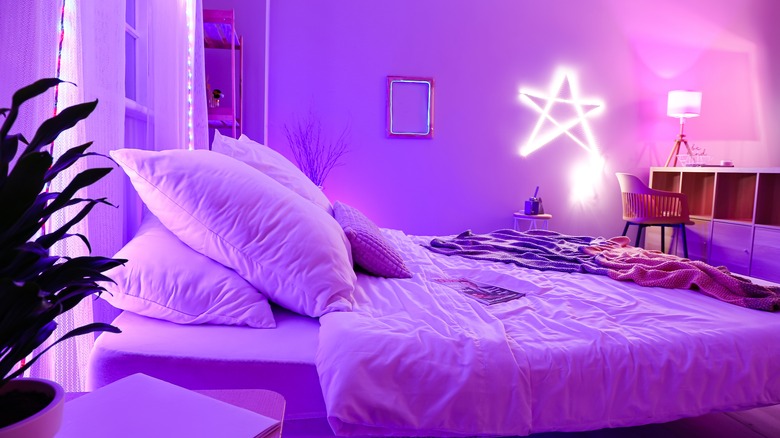 A purple lit bedroom 