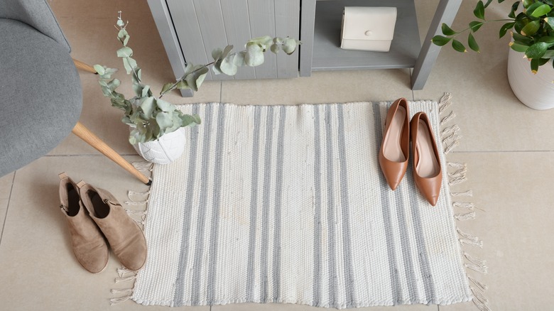 Rug with shoes and eucalyptus