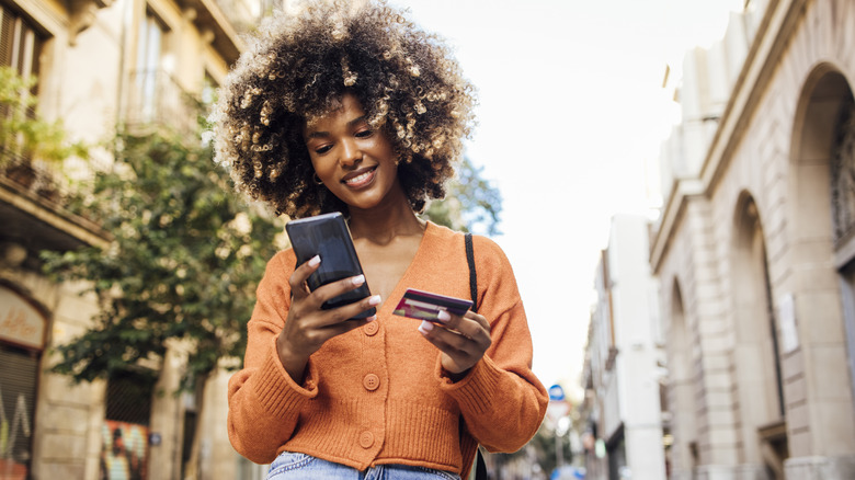 woman online shopping on phone