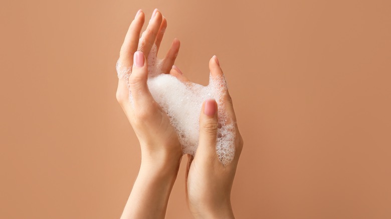 hands with soap suds