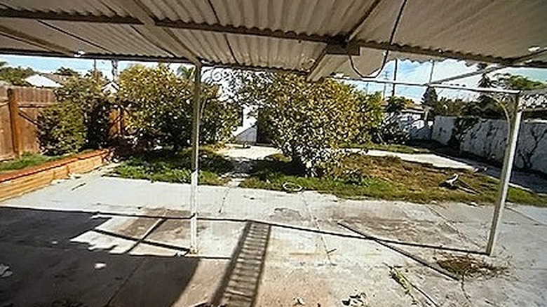 Decaying patio with broken awning