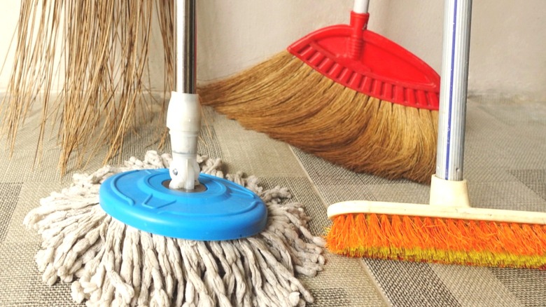 mop and three brooms