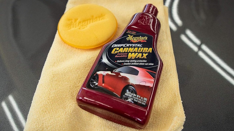 car wax on yellow towel