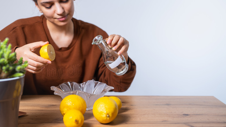 woman juicing lemons